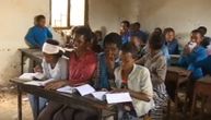 Ethiopian school built with Yugoslav money: No windows or toilets; two students sit in one chair