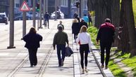 Belgraders can't resist the sun despite appeals: Parks are off-limit, but they walk along the rails