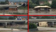 Swollen Ibar River crushes 2 rafts against bridges; they fall apart in seconds