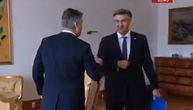 Cautious Croatian PM Plenkovic greets President Milanovic with elbow bump, leaves him confused