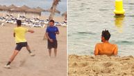 Novaka slikali dok trenira i meditira u moru, a onda se okrenuo i pokazao da je "utegnut kao praćka"