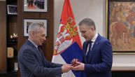 Russian Ambassador Bocan Kharchenko presents Serbian Defense Minister Stefanovic with medal