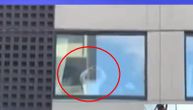 Novak filmed at hotel window: He's showing Serbs one symbol all the time and sending kisses