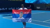 Lajovic unfurls Serbian flag with Novak's image, and with message for Australia: "Like it or not..."