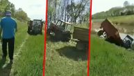 Prvi maj krenuo nizbrdo: Pijan odlučio da provoza traktor sa prikolicom uzbrdo, pa završio u reci