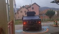 A Kosovo police armored vehicle enters Serb kindergarten grounds in Leposavic while children were asleep