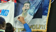 Novak signs Serbian flag with his and the image of a wolf, but also with a big error in Cyrillic