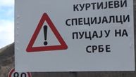 Road sign, "Kurti's special forces shooting Serbs," put up near Bistrica Bridge where Serb man was wounded