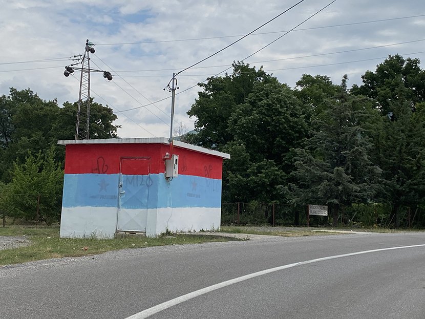 Tricolors near Podgorica Serbian flag painted by the road