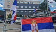 Serbs in Leposavic decorate KFOR's barbed wire and barricades with Serbian flags