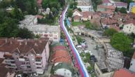 Aerial view of a huge Serbian flag carried by people in Zvecan, in Kosovo and Metohija