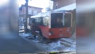 City bus skids on road in suburban Belgrade and ends up in house yard