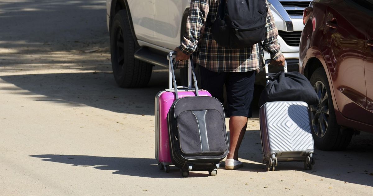 There's a Good Reason Why You Should NEVER Buy Black, Navy, or Gray Suitcases