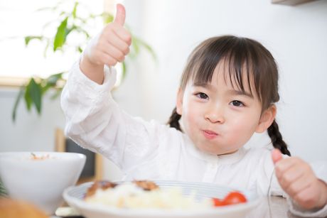 Young Japanese girl eating